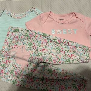 Carter's Pink and Blue onesie set.